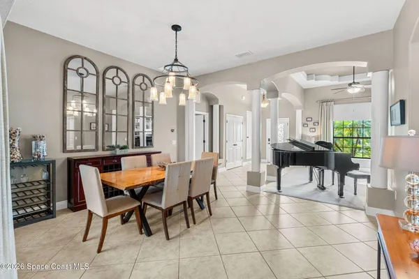 a view of walk in closet with clothes