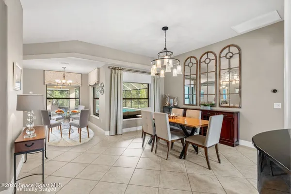 a bedroom with a bed and a ceiling fan