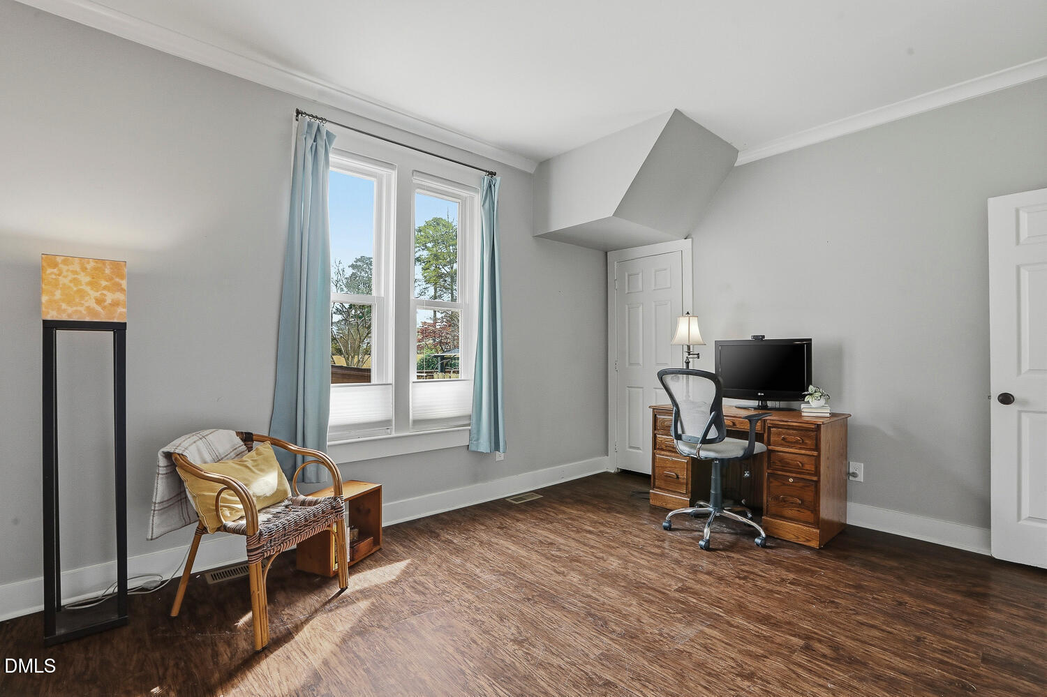 6023 Sentinel Drive Raleigh, NC 27609 - Photo 29 of 53 a workspace with wooden floor and a window