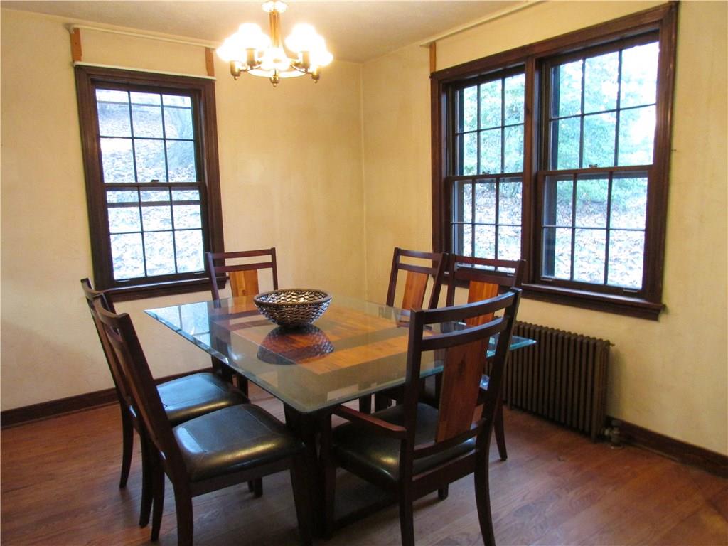 Dining Room has beautiful wood floors and overlooks the back and side yards.