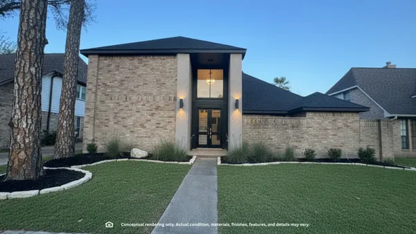 a brick house with a small yard