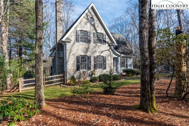 a view of a swimming pool with a yard