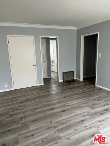 a living room with wooden floor