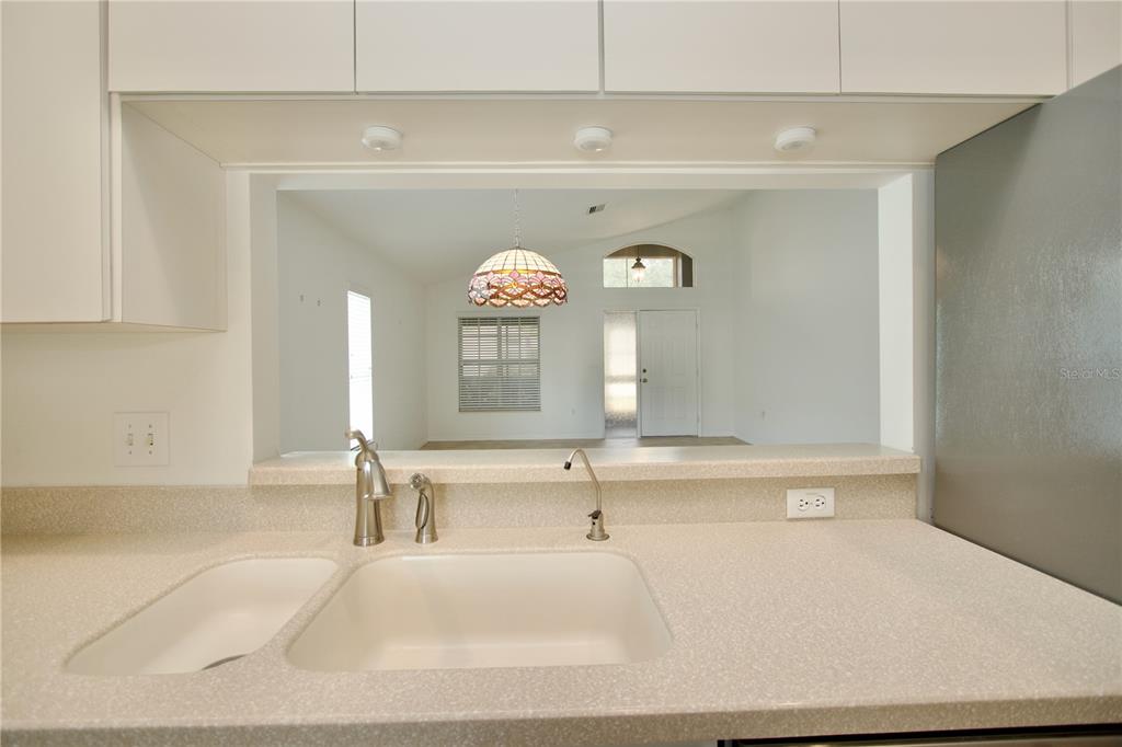 7842 Tenby Court New Port Richey, FL 34655 - Photo 13 of 27 a bathroom with a tub sink and a large mirror