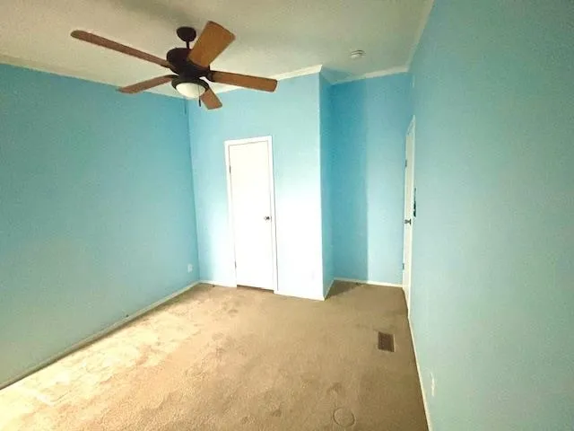 a view of a big room with carpet