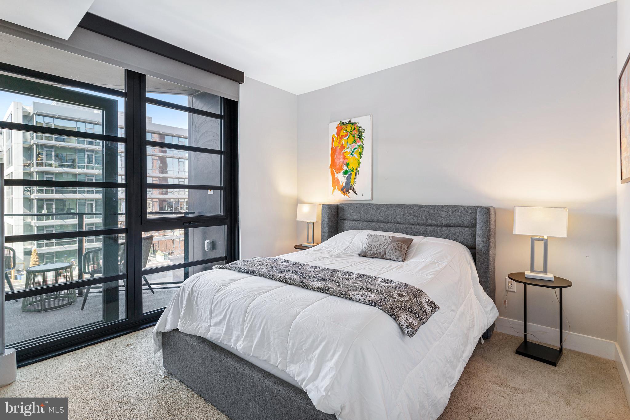 1300 4th Street Southeast, Unit 711 Washington, DC 20003 - Photo 12 of 28 a bedroom with a bed and a painting on the wall