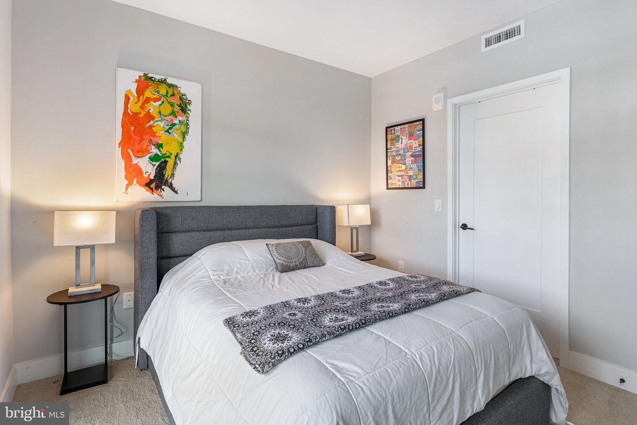 1300 4th Street Southeast, Unit 711 Washington, DC 20003 - Photo 13 of 28 a bedroom with a bed and a lamp