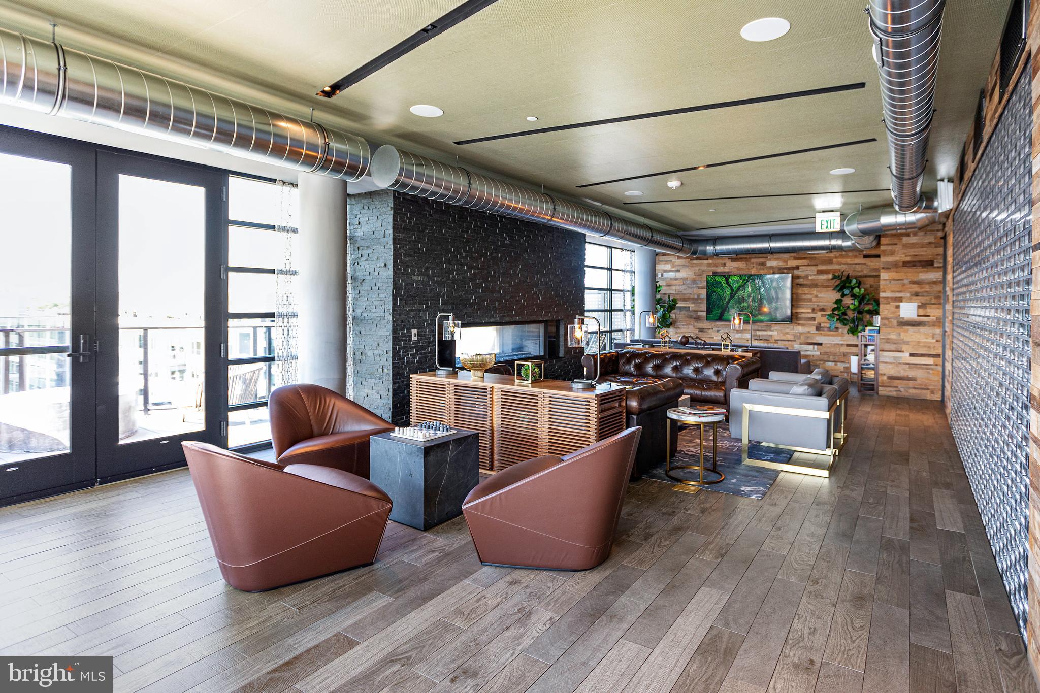 1300 4th Street Southeast, Unit 711 Washington, DC 20003 - Photo 23 of 29 a living room with furniture and a wooden floor