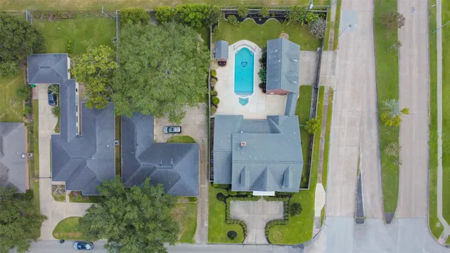 an aerial view of a house with a swimming pool