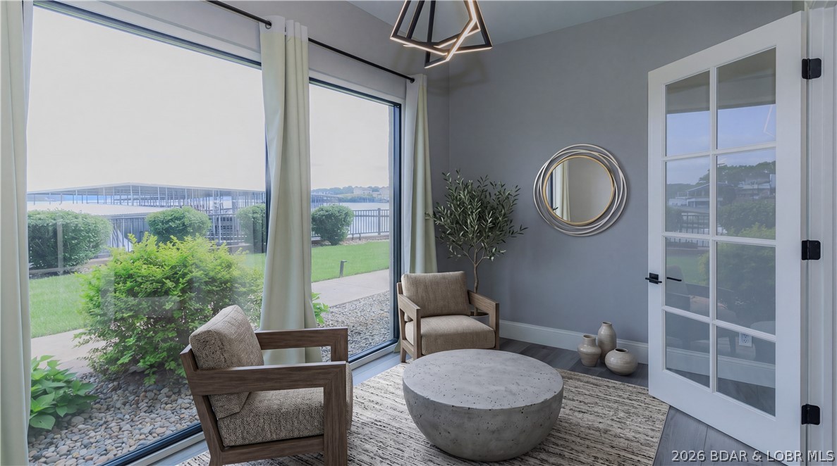 1184 Jeffries Road, Unit 115 Osage Beach, MO 65065 - Photo 2 of 34 sun room with new glass windows