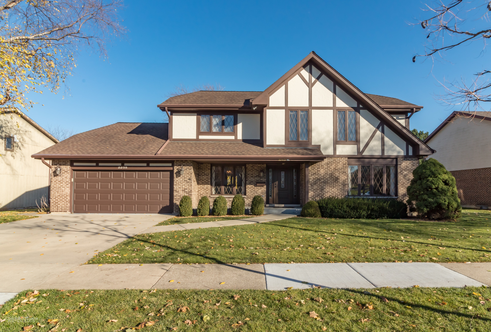 2203 North Ridge Avenue Arlington Heights, IL 60004 - Photo 1 of 23 a front view of a house with a yard