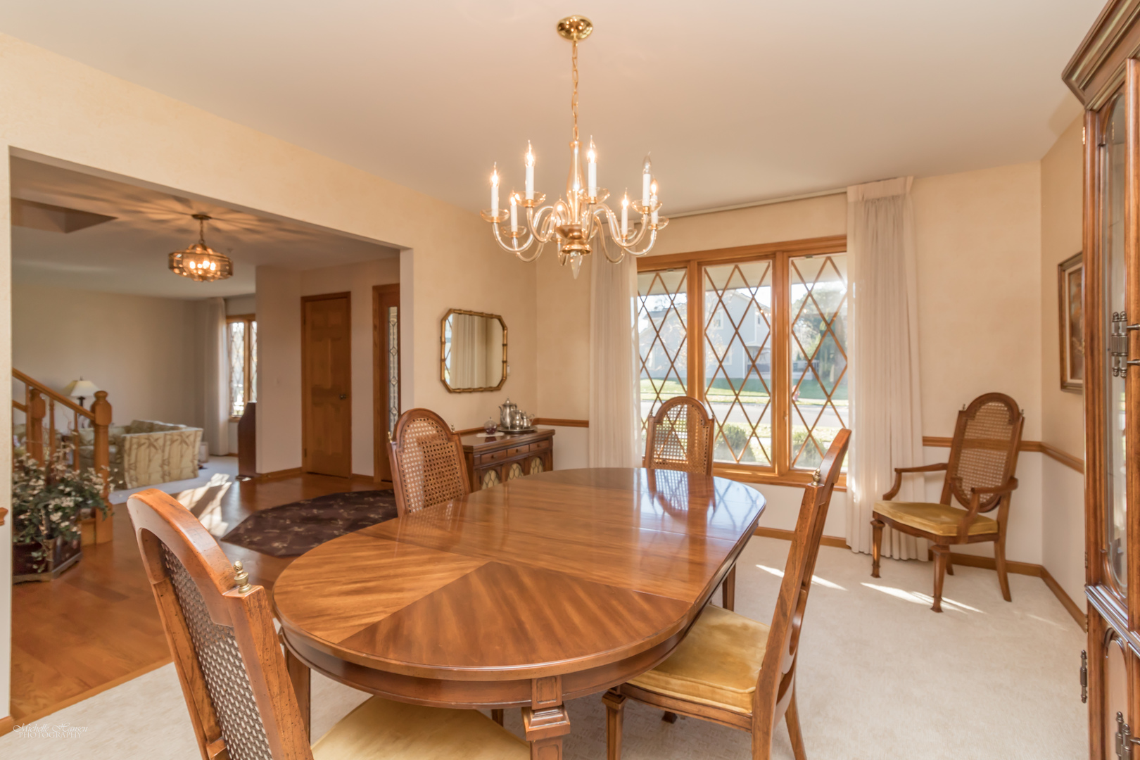 2203 North Ridge Avenue Arlington Heights, IL 60004 - Photo 5 of 23 a dining room with furniture and a chandelier