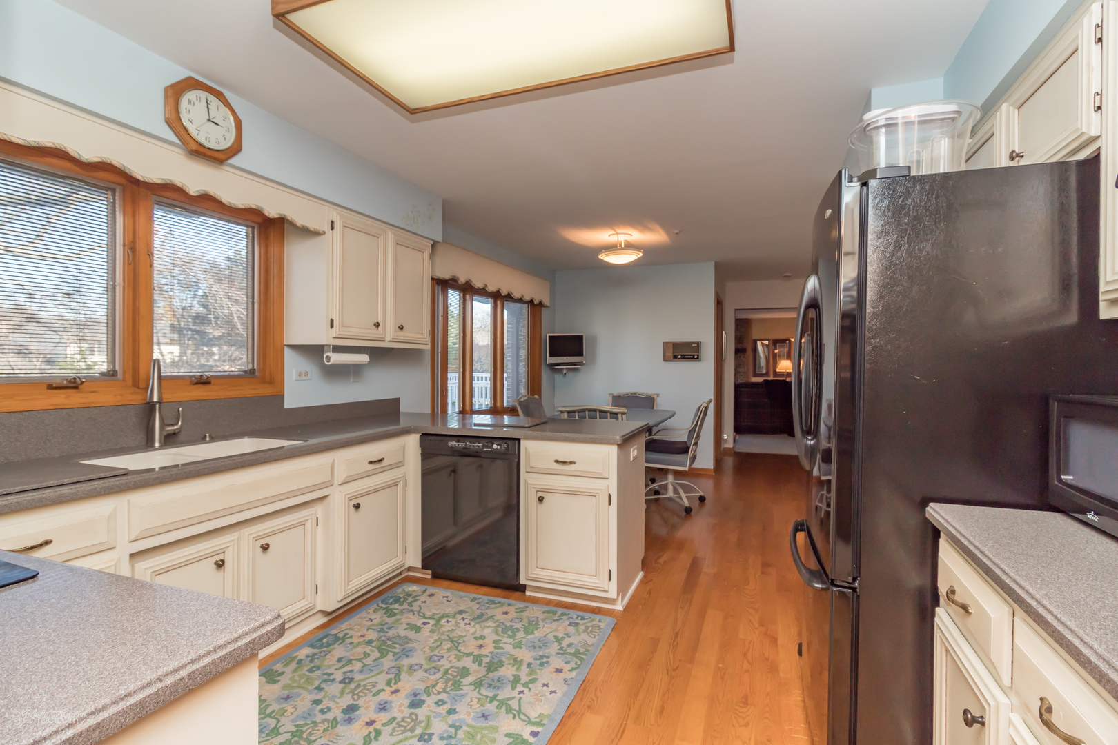2203 North Ridge Avenue Arlington Heights, IL 60004 - Photo 6 of 23 a kitchen with stainless steel appliances a stove a sink and a refrigerator