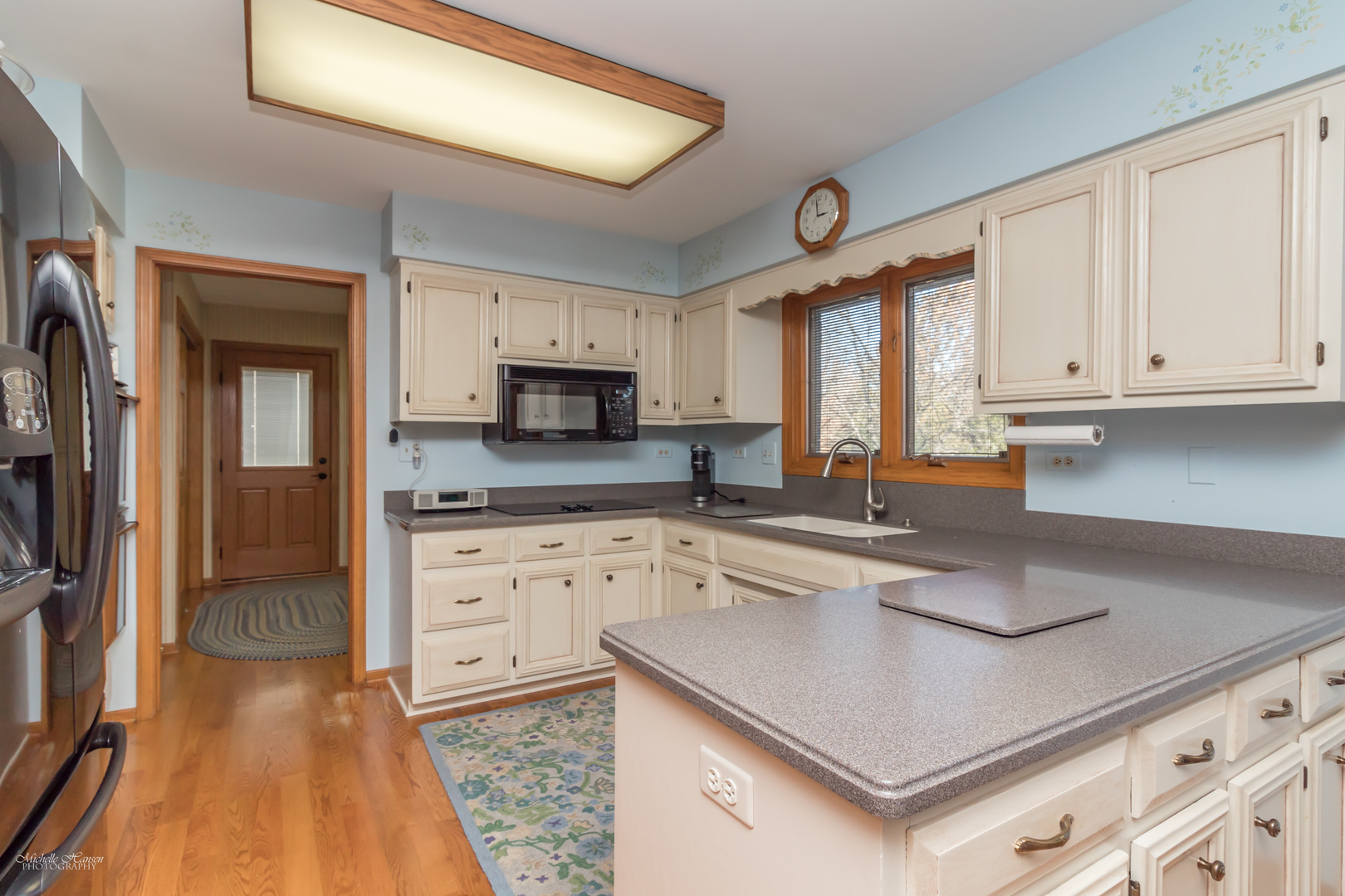 2203 North Ridge Avenue Arlington Heights, IL 60004 - Photo 7 of 23 a kitchen with granite countertop a sink stainless steel appliances and cabinets