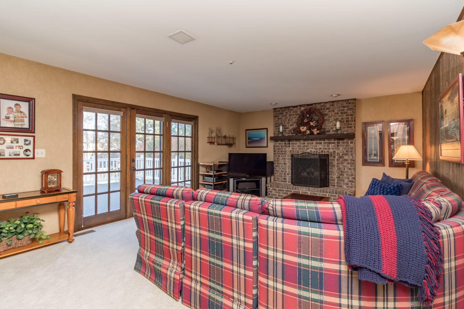 2203 North Ridge Avenue Arlington Heights, IL 60004 - Photo 10 of 23 a living room with furniture a flat screen tv and a fireplace