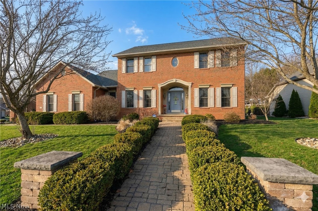 806 Forrest Ridge Drive Dover, OH 44622 - Photo 2 of 36 Colonial inspired home featuring brick siding and a front yard