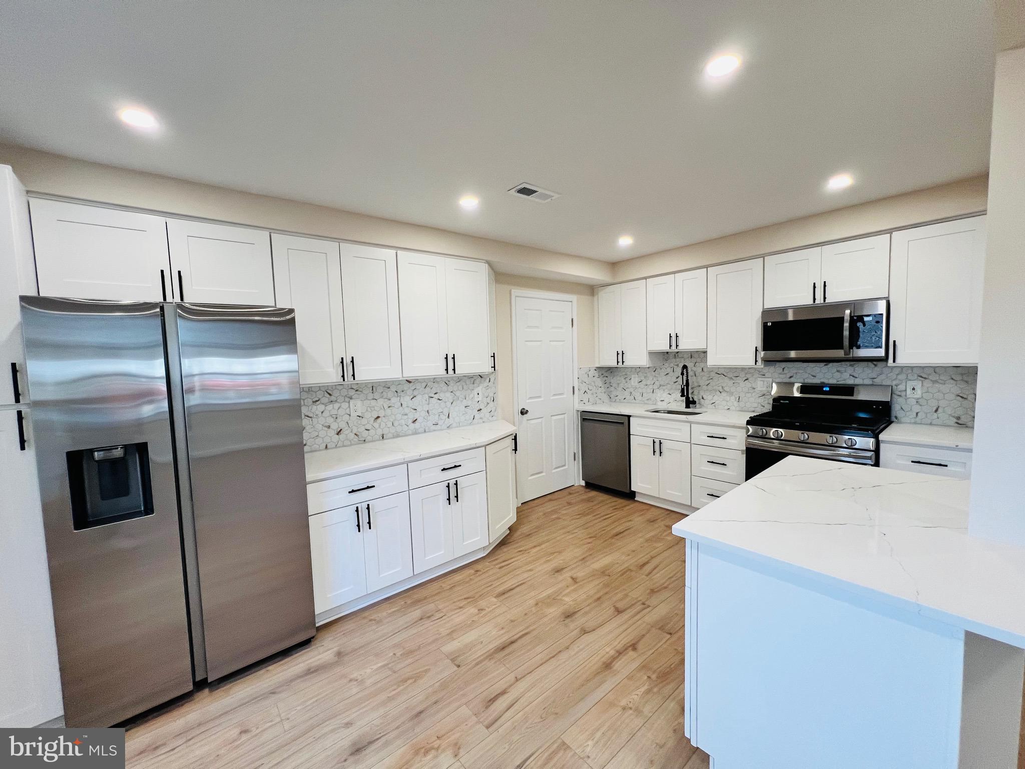 504 Selma Street Philadelphia, PA 19116 - Photo 14 of 31 a kitchen with a refrigerator sink and microwave