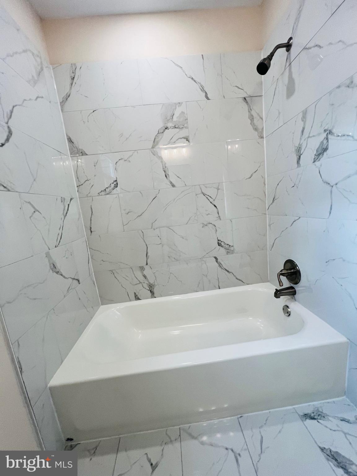 504 Selma Street Philadelphia, PA 19116 - Photo 21 of 31 a bathroom with a bathtub and shower