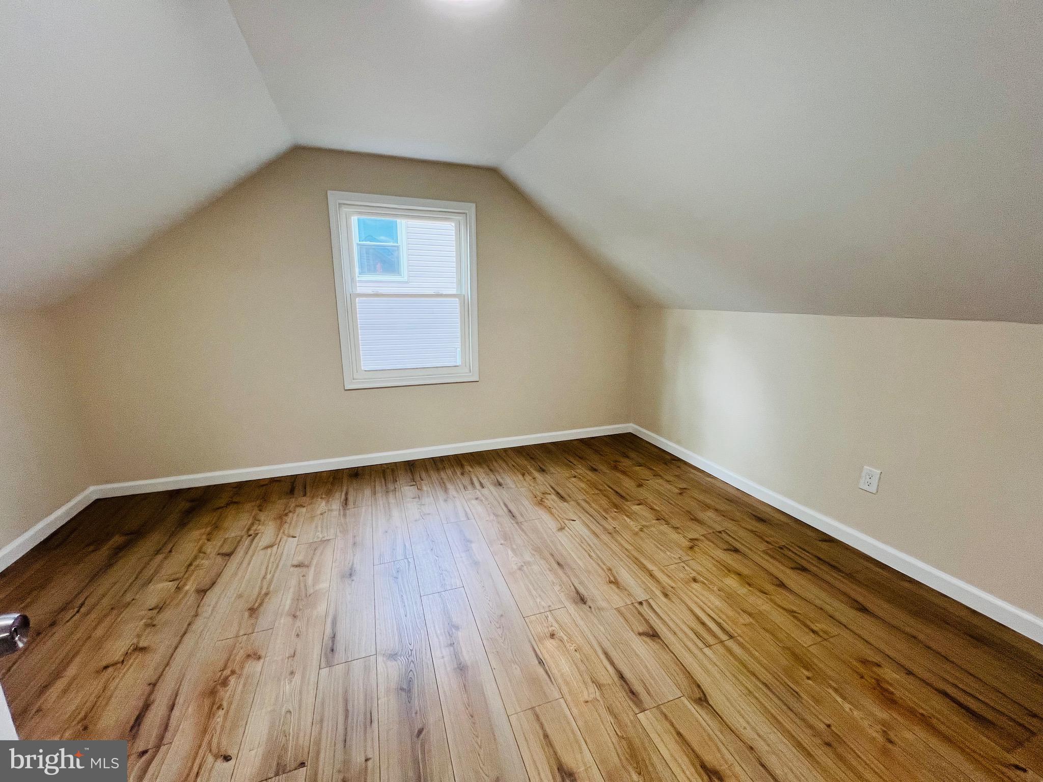 504 Selma Street Philadelphia, PA 19116 - Photo 24 of 31 an empty room with wooden floor and windows