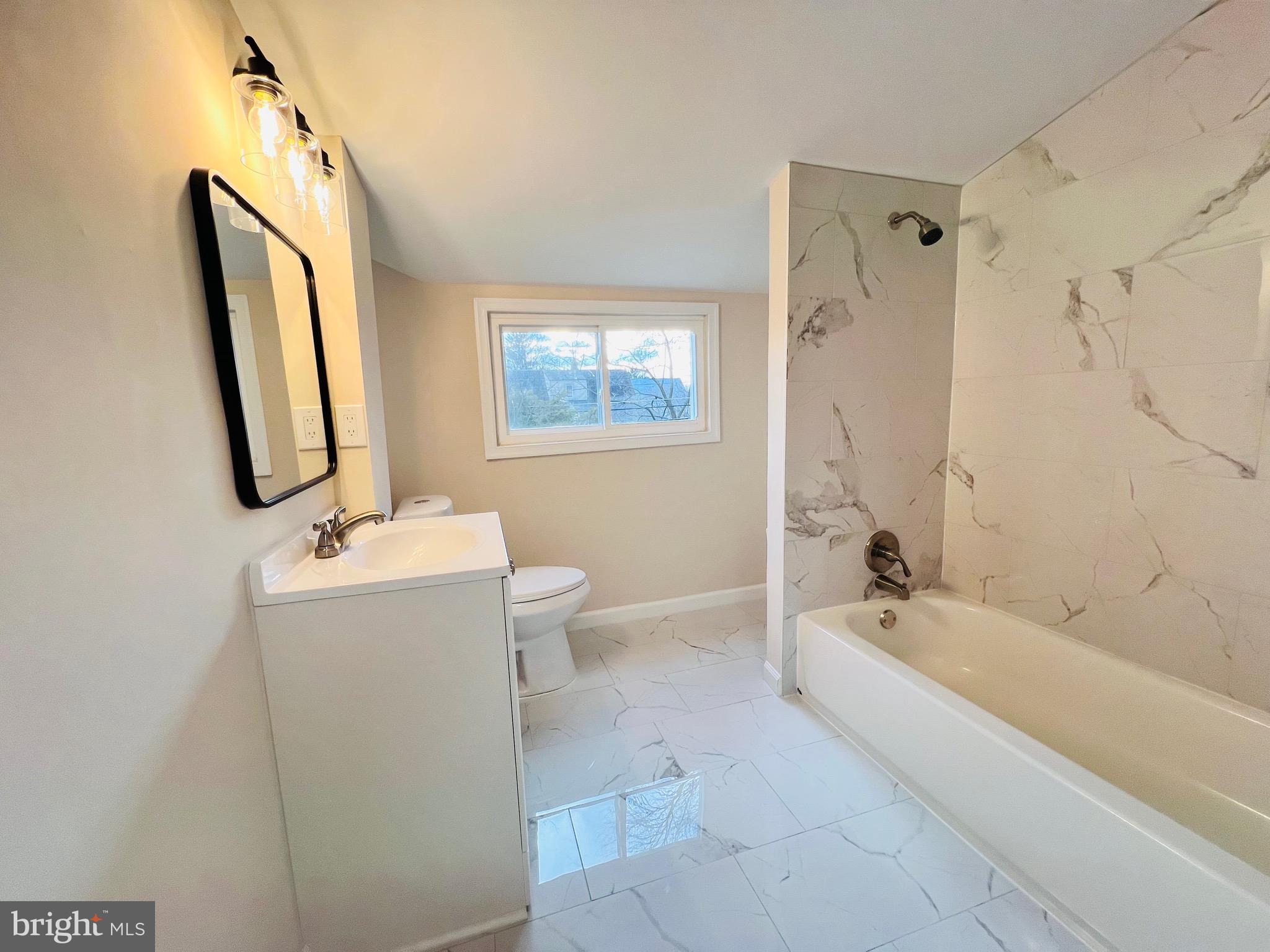 504 Selma Street Philadelphia, PA 19116 - Photo 26 of 31 a bathroom with a sink a toilet and a bathtub