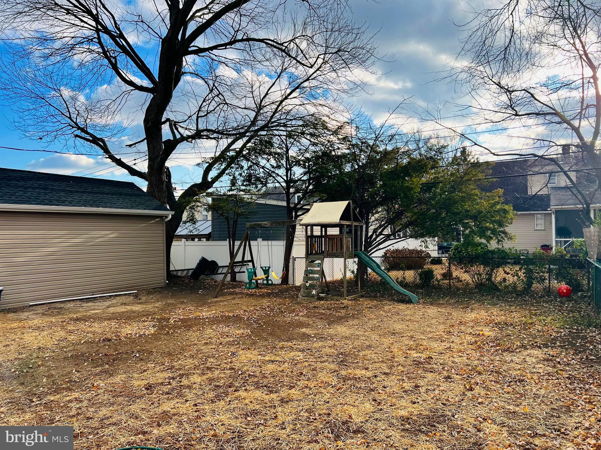 504 Selma Street Philadelphia, PA 19116 - Photo 30 of 31 a view of a house with a yard and a parked car