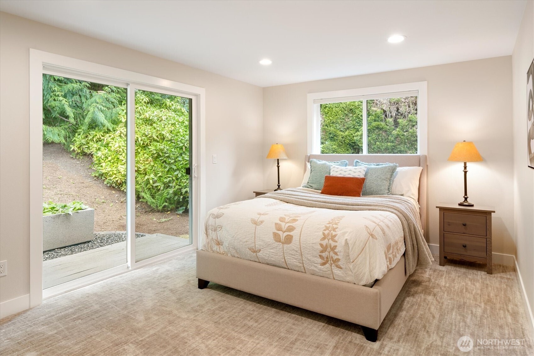 9503 Odin Way Bothell, WA 98011 - Photo 27 of 39 a spacious bedroom with a bed and a large window