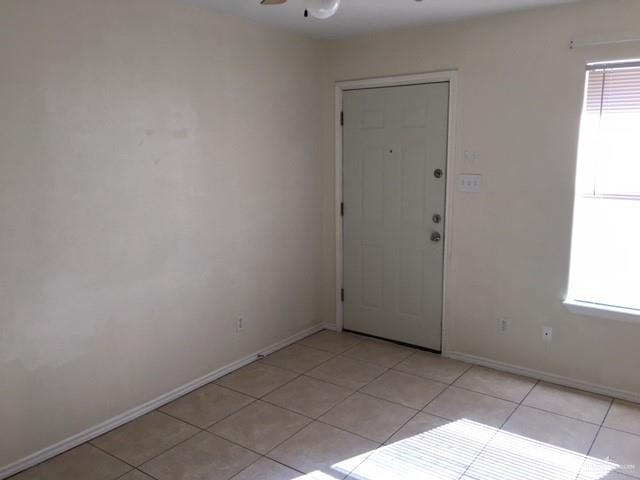 401 Rockport Street Alton, TX 78573 - Photo 11 of 11 Spare room with light tile patterned flooring and a ceiling fan