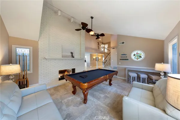 a living room with furniture a rug and a chandelier