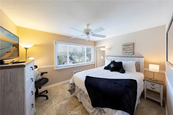 a bed room with a bed and a window