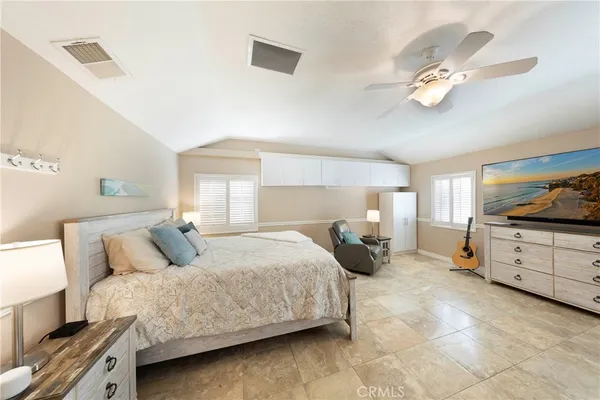 a bedroom with bed and window