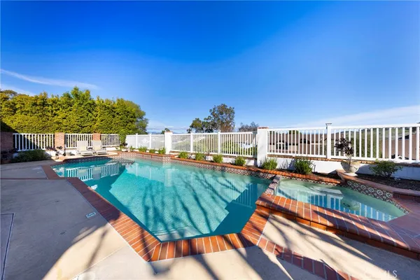 a view of a swimming pool with a lounge chairs