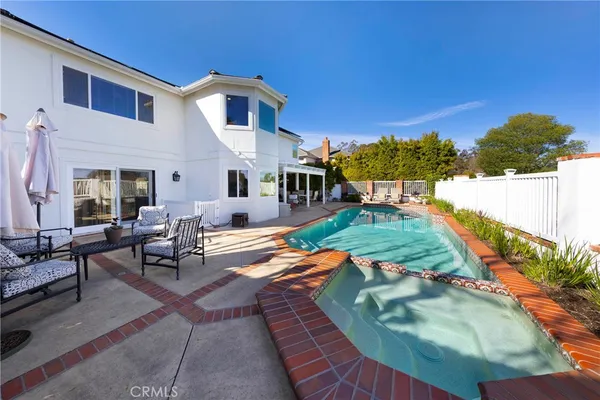 an outdoor space with lounge chair