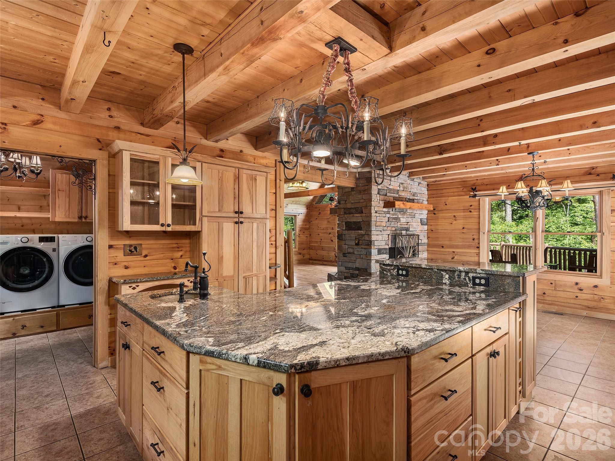 413 Green Hills Road Mill Spring, NC 28756 - Photo 14 of 48 a kitchen with stainless steel appliances granite countertop a sink and cabinets