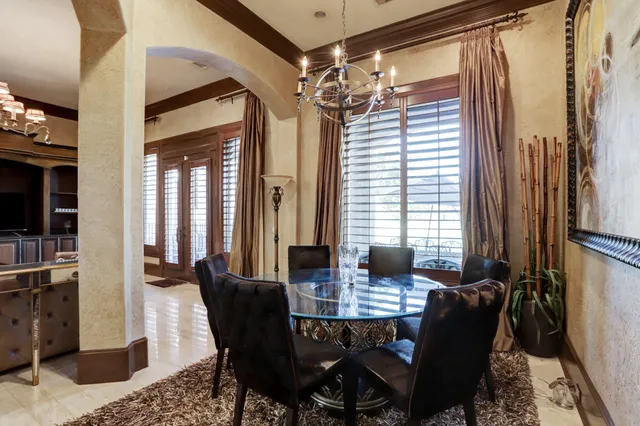a view of a dining room with furniture and window