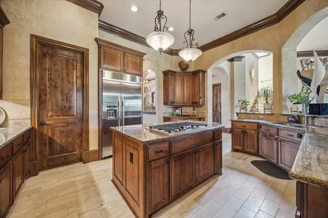 a kitchen with a stove oven and a refrigerator