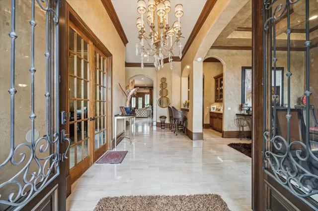 a view of an entryway with a floor to ceiling window and a livingroom with furniture