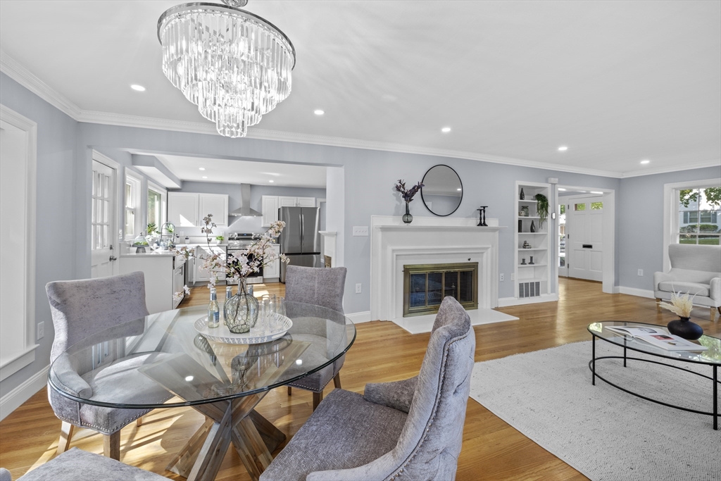 108 Radcliffe Road Belmont, MA 02478 - Photo 11 of 39 a living room with furniture a chandelier and a fireplace