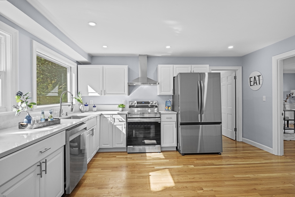 108 Radcliffe Road Belmont, MA 02478 - Photo 14 of 39 a kitchen with a sink cabinets stainless steel appliances and a window