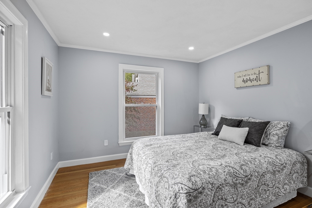 108 Radcliffe Road Belmont, MA 02478 - Photo 19 of 39 a bedroom with a bed and a painting on the wall