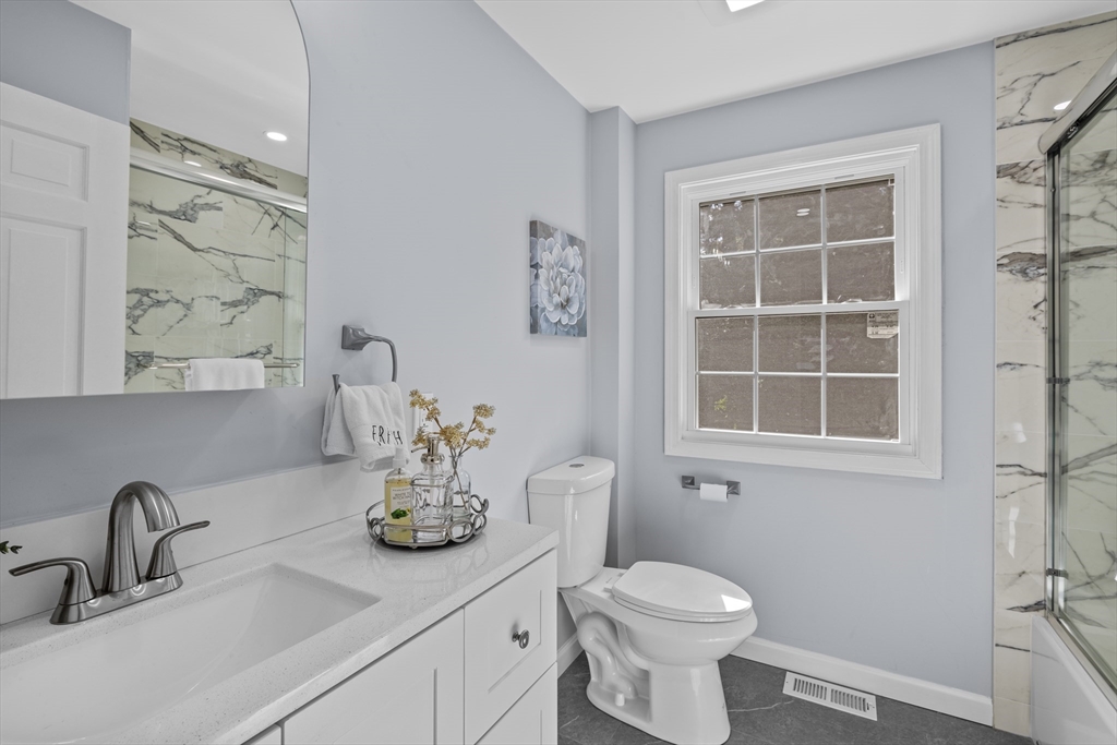 108 Radcliffe Road Belmont, MA 02478 - Photo 20 of 39 a bathroom with a toilet sink and mirror
