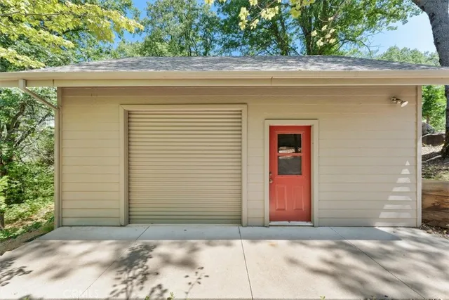 a view of a house with a backyard