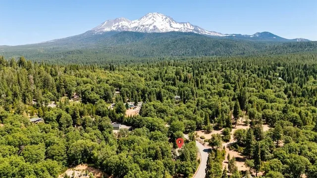 a view of a city with mountains in the background