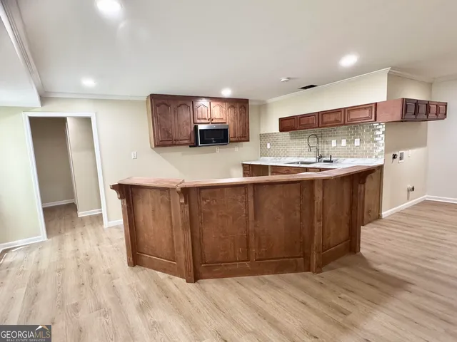 a kitchen with stainless steel appliances granite countertop a sink and cabinets