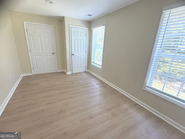 a view of an empty room and window