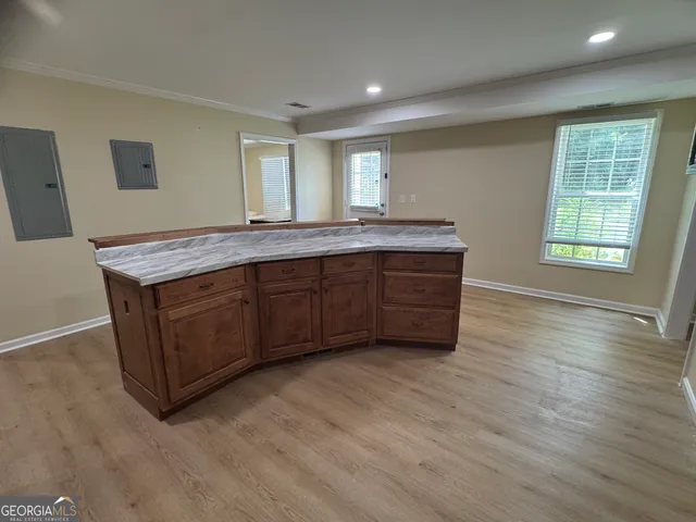 a room with furniture and wooden floor