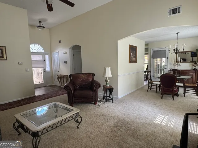 a living room with furniture and a window