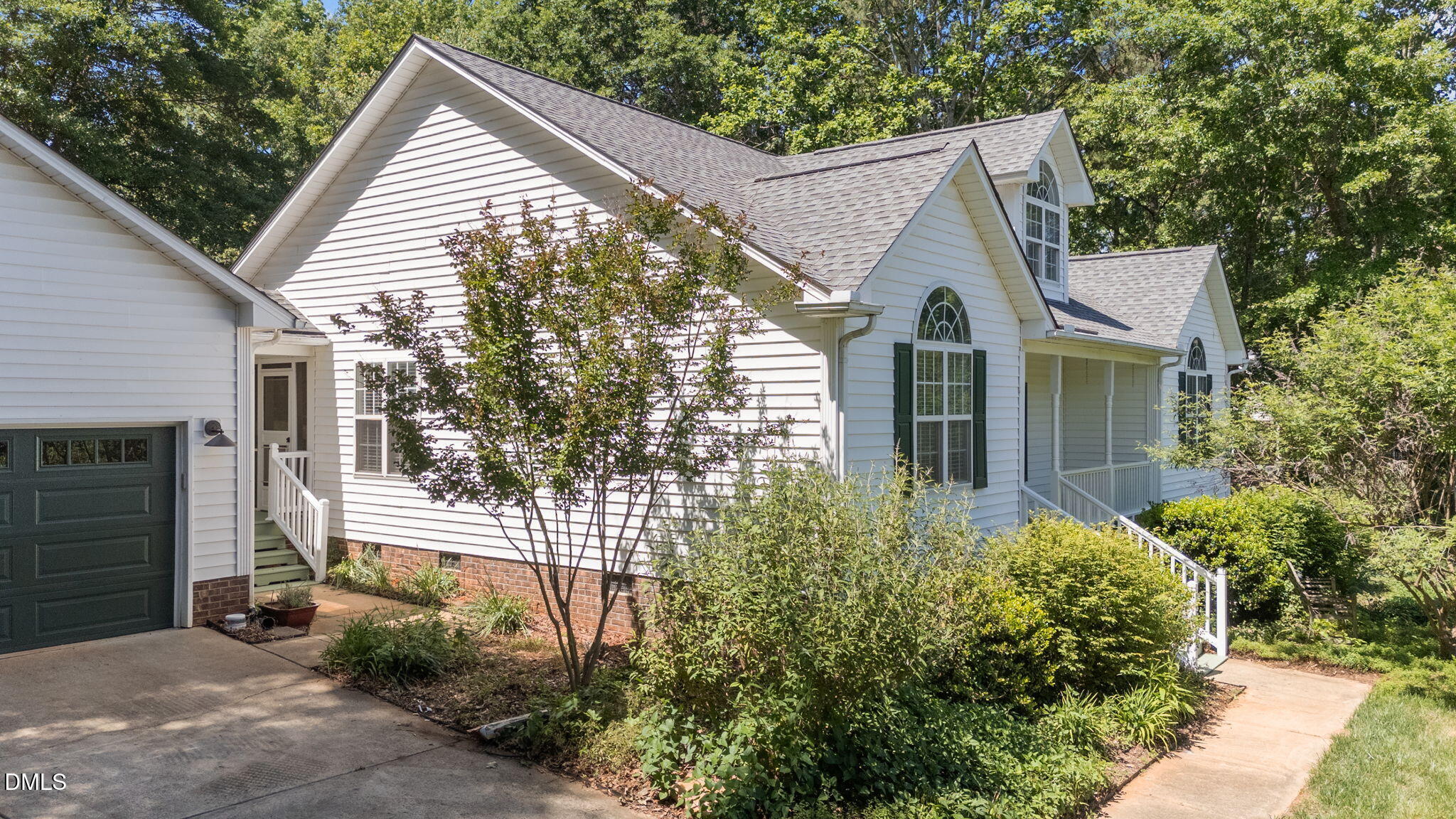 6820 Oviedo Drive Raleigh, NC 27603 - Photo 45 of 50 a view of a house with a yard and plants