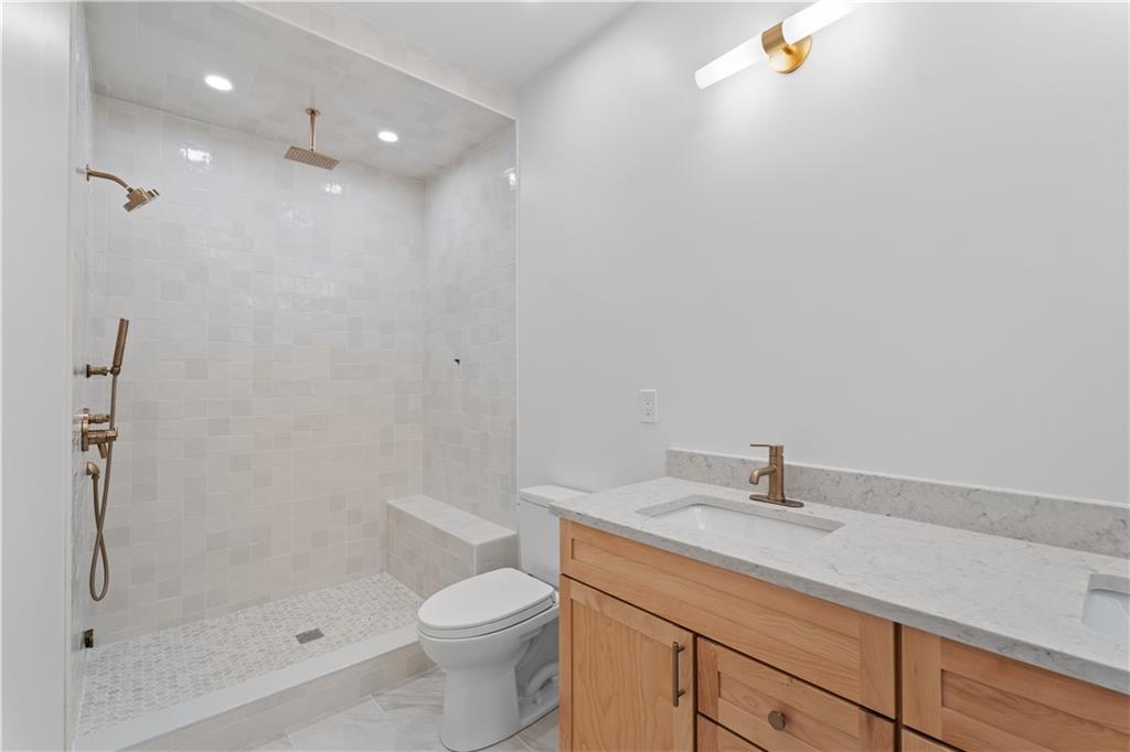 256 44th Street Pittsburgh, PA 15201 - Photo 23 of 45 a bathroom with a sink a toilet and shower