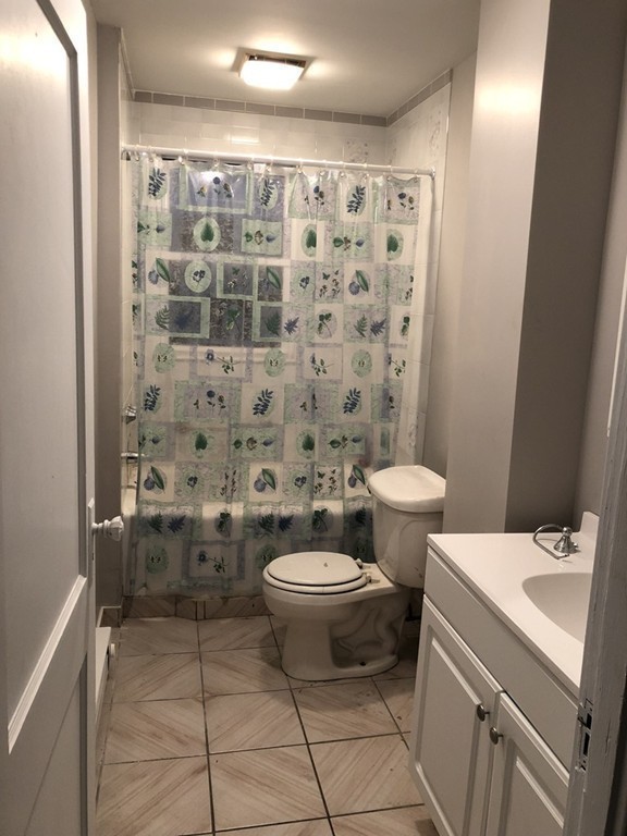 227 Ames Street Fall River, MA 02721 - Photo 15 of 18 a bathroom with a sink toilet and shower