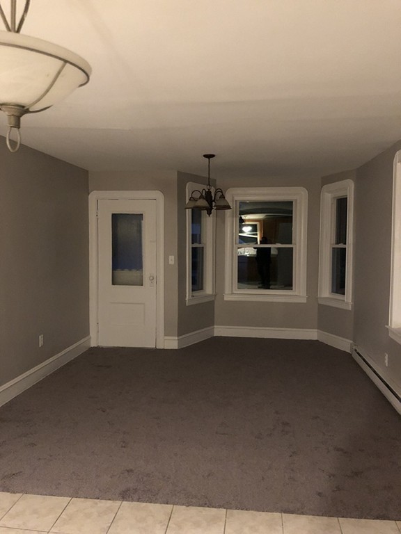 227 Ames Street Fall River, MA 02721 - Photo 18 of 18 a view of a livingroom with a fireplace